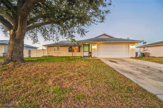 single story home with a front yard and a garage