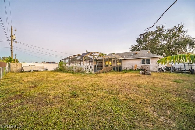 view of yard with a lanai