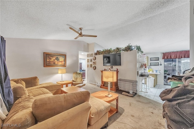 living room featuring a textured ceiling, light colored carpet, ceiling fan, and lofted ceiling