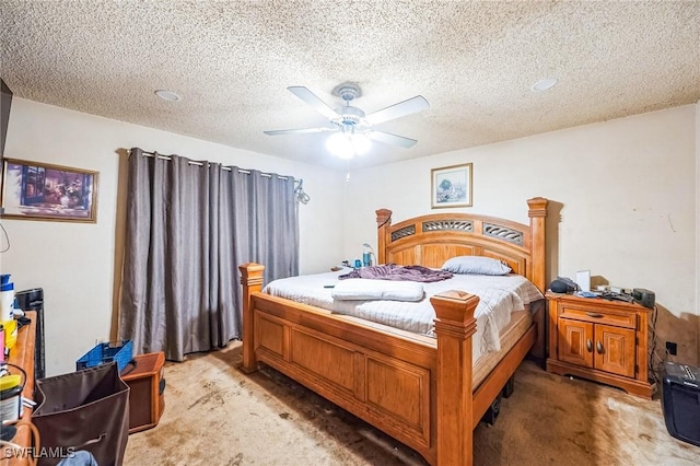 carpeted bedroom with ceiling fan and a textured ceiling