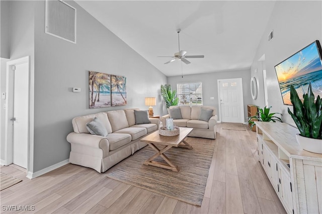 living room with high vaulted ceiling, light hardwood / wood-style floors, and ceiling fan