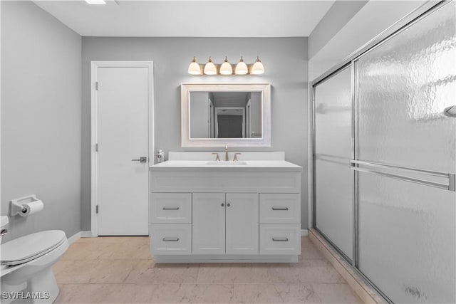 bathroom with vanity, toilet, and walk in shower