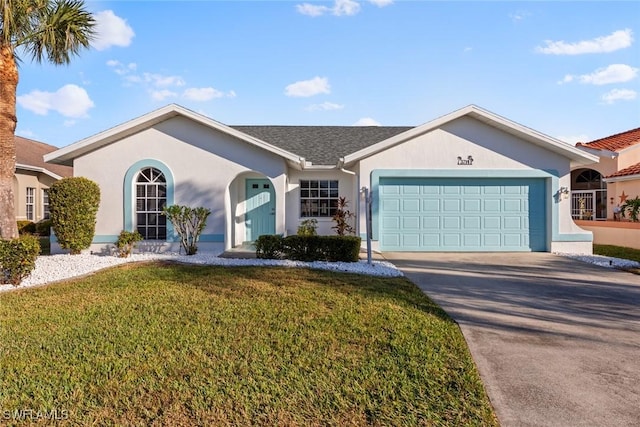 ranch-style house featuring a garage and a front lawn