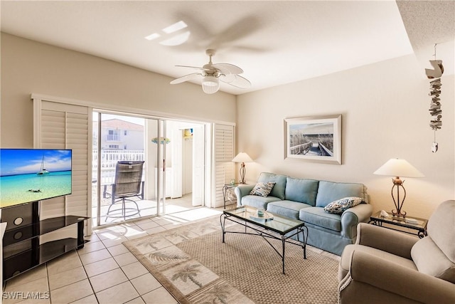 tiled living room with ceiling fan