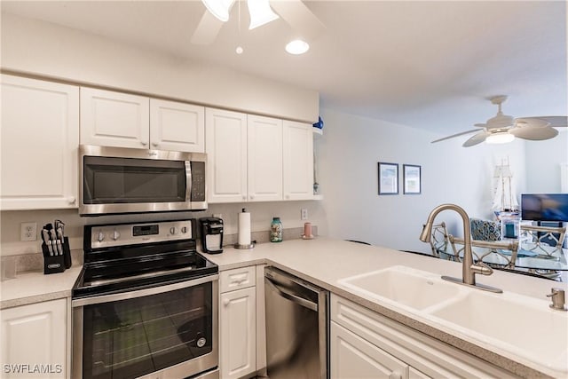 kitchen with white cabinetry and stainless steel appliances