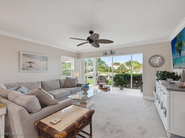 living room featuring light colored carpet, ceiling fan, and ornamental molding