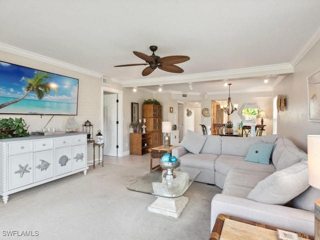 carpeted living room featuring ceiling fan with notable chandelier and ornamental molding