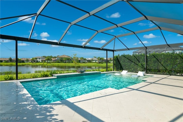 view of swimming pool with a water view, glass enclosure, and a patio area