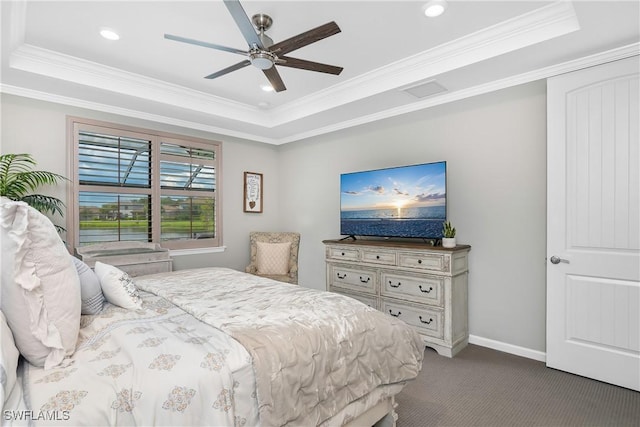 bedroom with carpet, ceiling fan, a raised ceiling, and ornamental molding