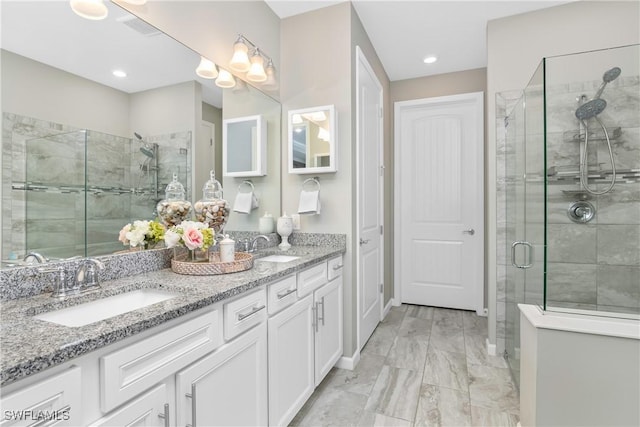 bathroom with vanity and an enclosed shower