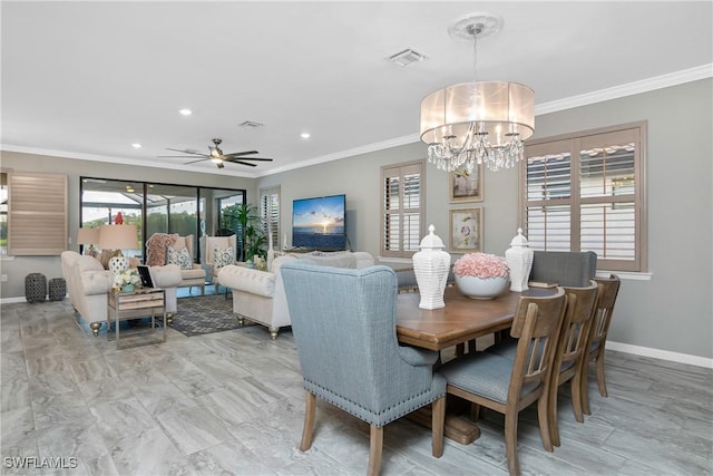 dining space featuring ceiling fan with notable chandelier and crown molding