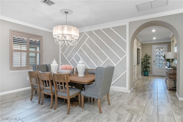 dining space featuring an inviting chandelier, a wealth of natural light, and crown molding