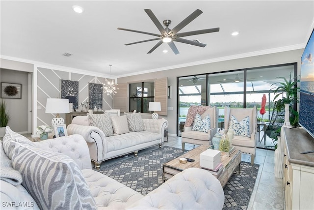 tiled living room with ceiling fan with notable chandelier and crown molding