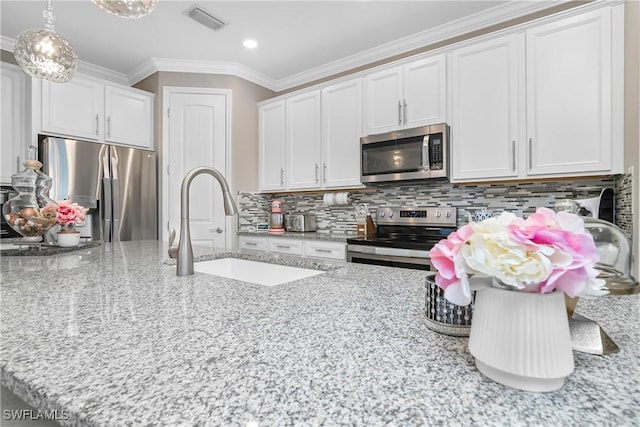 kitchen with white cabinetry, sink, and appliances with stainless steel finishes