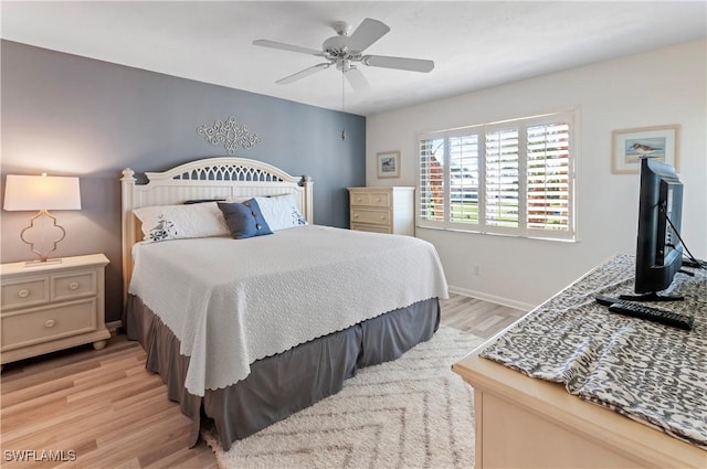 bedroom with ceiling fan and light wood-type flooring