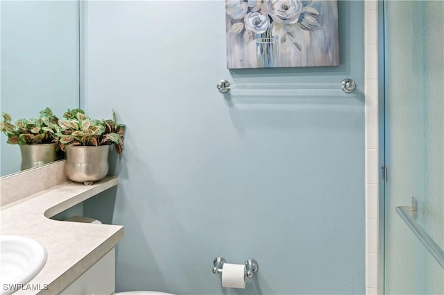 bathroom with vanity and toilet