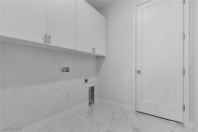 clothes washing area featuring hookup for an electric dryer, washer hookup, gas dryer hookup, and cabinets