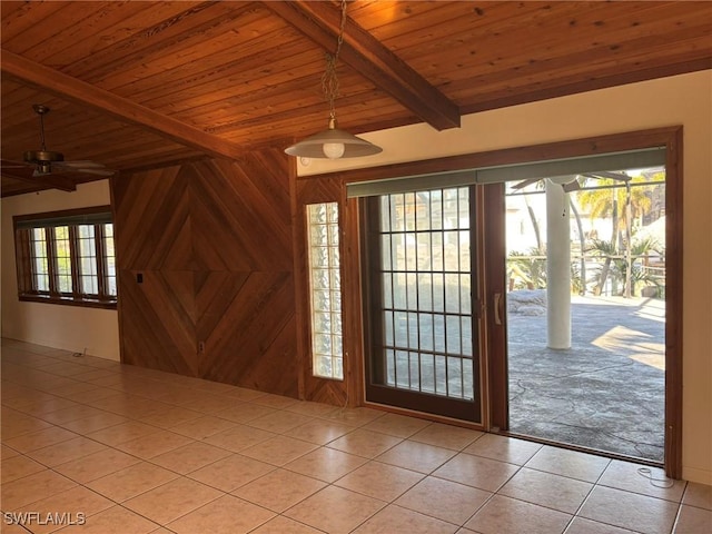 tiled entryway featuring plenty of natural light, ceiling fan, and wooden ceiling