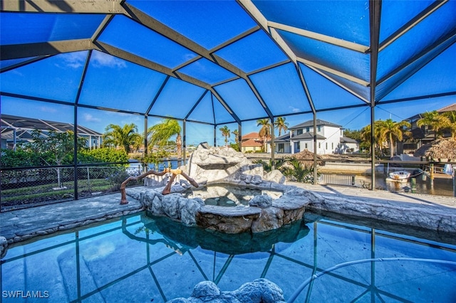 view of swimming pool with a lanai