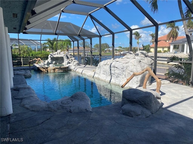 view of pool featuring glass enclosure and pool water feature