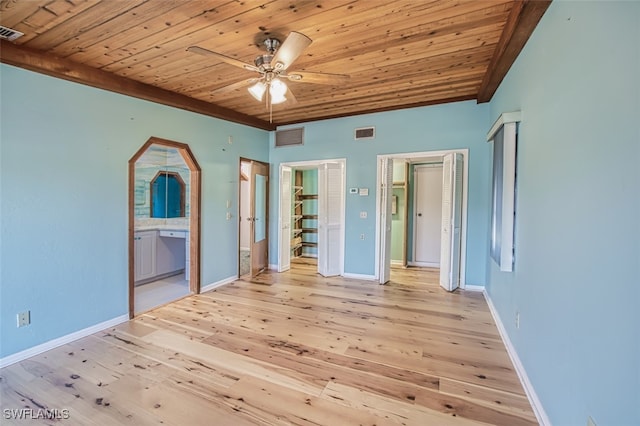 unfurnished bedroom featuring light wood-type flooring, ensuite bathroom, ceiling fan, and wood ceiling