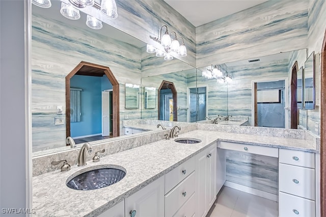 bathroom with vanity, tile patterned floors, and tile walls