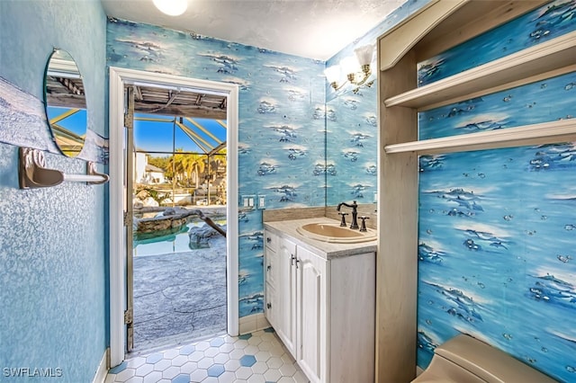 bathroom with tile patterned floors, vanity, and toilet