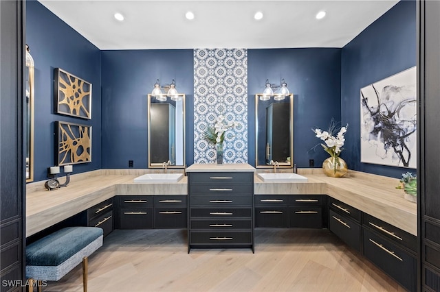 bathroom with hardwood / wood-style floors and vanity