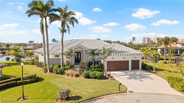 view of front facade with a garage and a front yard