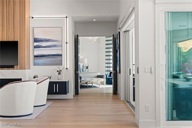 hallway featuring light hardwood / wood-style floors