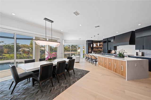 dining space featuring light hardwood / wood-style floors