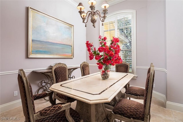 tiled dining space featuring crown molding and an inviting chandelier