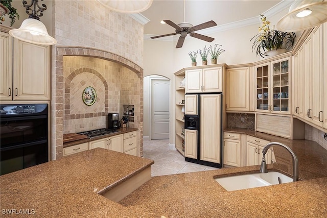 kitchen with pendant lighting, sink, ornamental molding, double oven, and stainless steel gas cooktop