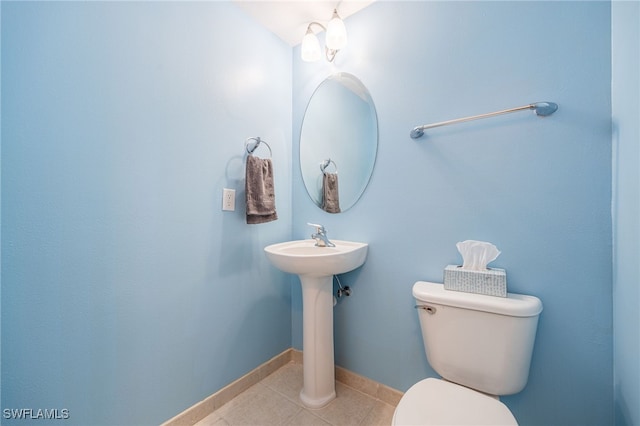 bathroom featuring tile patterned floors and toilet