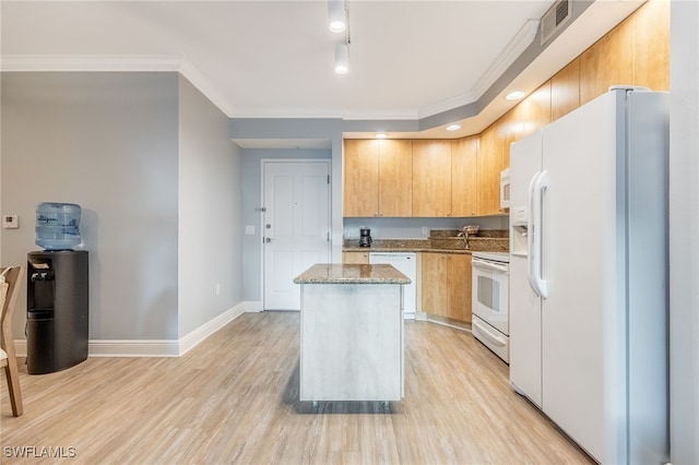 kitchen featuring a center island, white appliances, crown molding, light hardwood / wood-style floors, and light stone counters