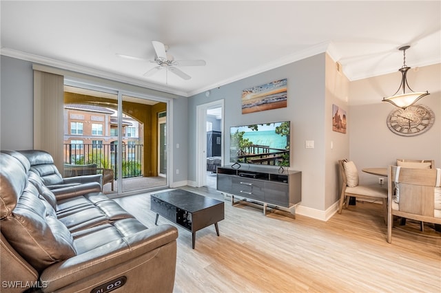 living room featuring light wood-type flooring, ceiling fan, and ornamental molding