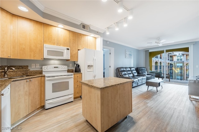 kitchen featuring white appliances, sink, a kitchen island, ornamental molding, and light hardwood / wood-style floors