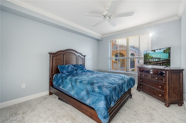 bedroom featuring ceiling fan, light colored carpet, and ornamental molding