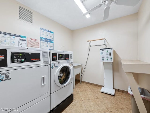 laundry area with washing machine and dryer, ceiling fan, and light tile patterned flooring