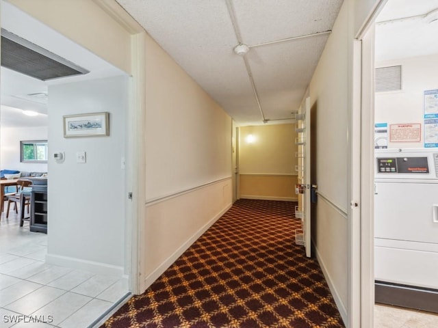 hall featuring light colored carpet