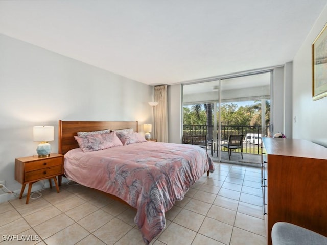 bedroom featuring light tile patterned floors and access to outside