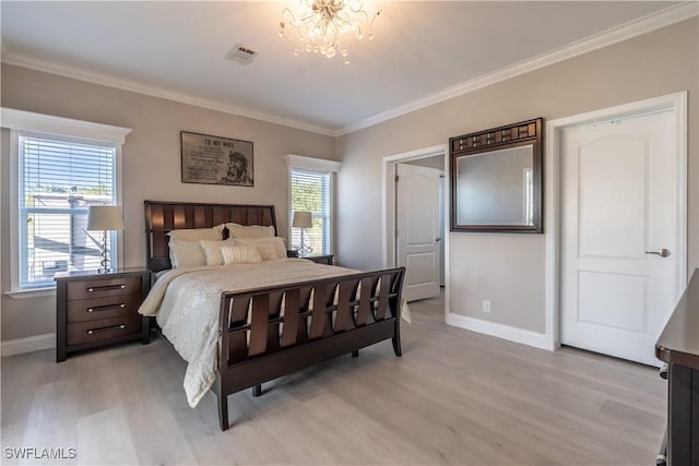 bedroom featuring an inviting chandelier, light hardwood / wood-style flooring, multiple windows, and ornamental molding