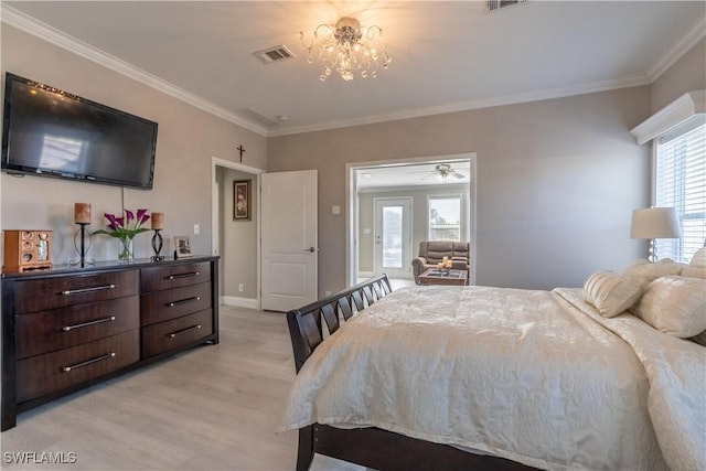 bedroom featuring a notable chandelier, light wood-type flooring, and crown molding