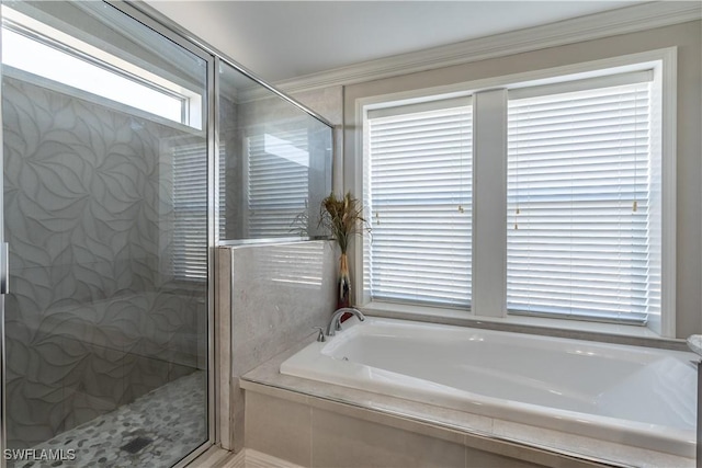 bathroom featuring independent shower and bath and ornamental molding