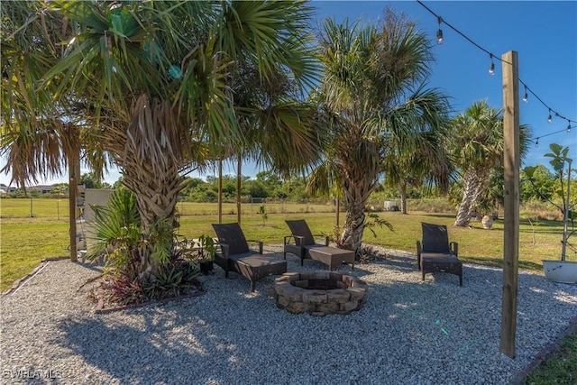 view of yard featuring a fire pit