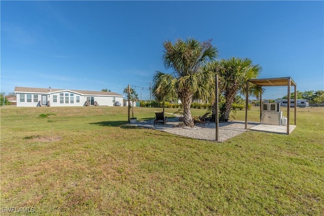 4008 24th Ave NE, Naples, FL 34120 - view of grassy yard with a patio area