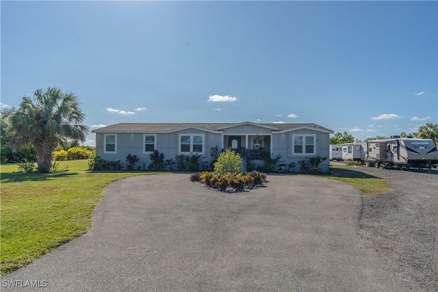 single story home featuring a front yard