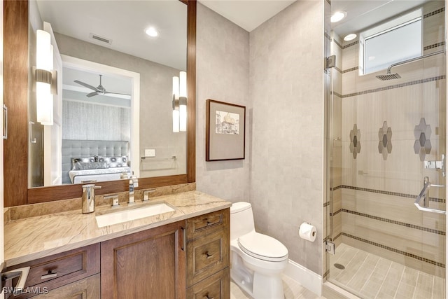 bathroom with walk in shower, ceiling fan, vanity, and toilet