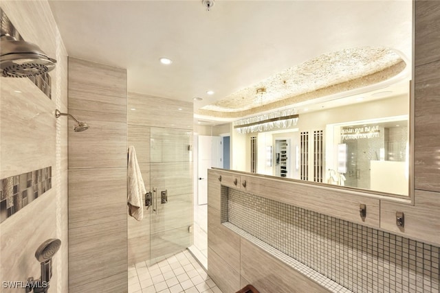 bathroom featuring tile patterned flooring and an enclosed shower