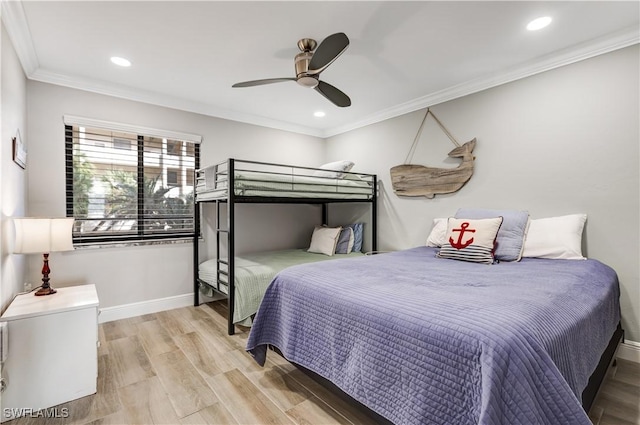 bedroom featuring ornamental molding, ceiling fan, and light hardwood / wood-style floors